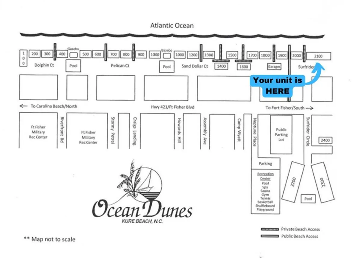 A sweeping aerial view of the Ocean Dunes resort complex, featuring the Atlantic Ocean, multiple pools, and recreation areas. You can see the direct beach access, various buildings, and wide stretches of sand inviting families to play and explore.